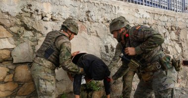 Spanish soldiers find a migrant hiding in a tunnel at the Tarajal beach, after mass crossings of migrants on foot and by sea from Morocco into Spanish territory, Ceuta, Spain, Aug. 1, 2026. (Reuters Photo)