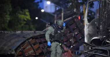 A police officer inspects the wreckage of a truck after a car bomb detonated near a police station, Cucuta, Colombia, Aug. 1, 2026. (AFP Photo)
