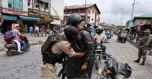 An Indian police officer frisks a man during a search operation, Srinagar, Indian Kashmir, Aug. 1, 2026. (EPA Photo)