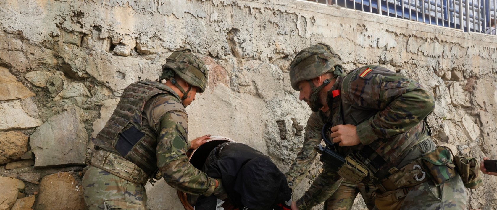 Spanish soldiers find a migrant hiding in a tunnel at the Tarajal beach, after mass crossings of migrants on foot and by sea from Morocco into Spanish territory, Ceuta, Spain, Aug. 1, 2026. (Reuters Photo)