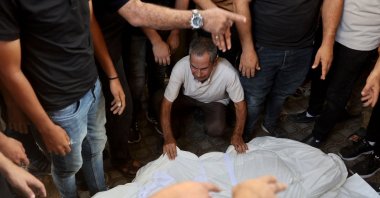 A mourner grieves over the body of a Palestinian killed in an overnight Israeli airstrike, at the al-Shifa Hospital in Gaza City, Palestine, Aug. 2, 2026. (AFP Photo)