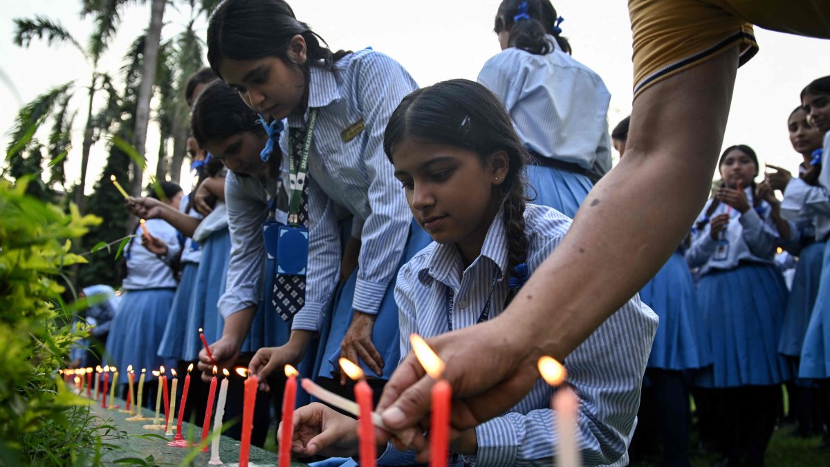 Mourners and students light candles to offer their condolences after the death of mountaineer Nirmal Purja and his companions in an avalanche in Pakistan, at Small Heaven School in Chitwan, Nepal, Aug. 2, 2026. (AFP Photo)