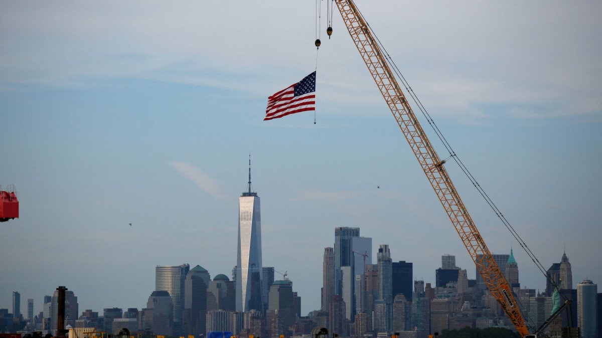 An American Flag hangs from a crane at Port Liberty in Bayonne, New Jersey, U.S., July 24, 2026. (AFP Photo)