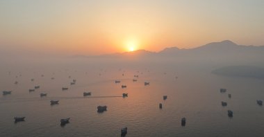 A drone view shows vessels in the Strait of Hormuz, as seen from Musandam, Oman, June 15, 2026. (Reuters Photo)
