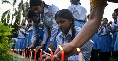 Mourners and students light candles to offer their condolences after the death of mountaineer Nirmal Purja and his companions in an avalanche in Pakistan, at Small Heaven School in Chitwan, Nepal, Aug. 2, 2026. (AFP Photo)