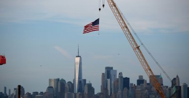An American Flag hangs from a crane at Port Liberty in Bayonne, New Jersey, U.S., July 24, 2026. (AFP Photo)