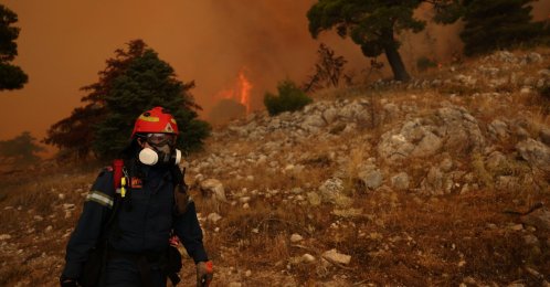 A firefighter works as a wildfire burns on Mount Kithairon, Greece, Aug. 3, 2026. (Reuters Photo)