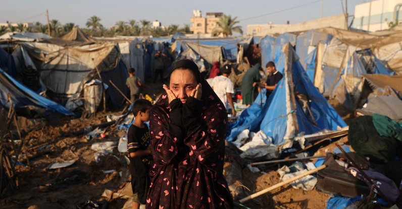 A displaced Palestinian woman reacts as she looks at the destruction of tent shelters following an Israeli airstrike in Deir el-Balah, central Gaza Strip, Palestine, Aug. 1, 2026. (AFP Photo)