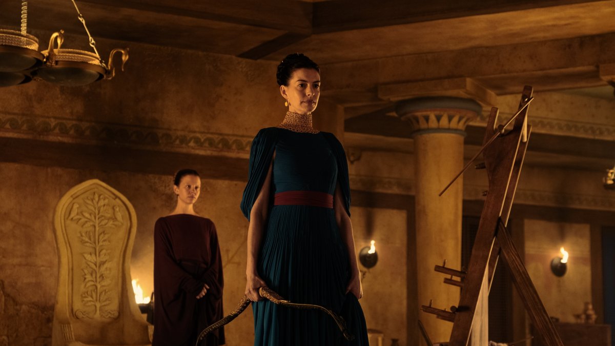This image released by Universal Pictures shows, from left, Mia Goth as Melantho, and Anne Hathaway as Penelope, in a scene from "The Odyssey." (AP Photo)