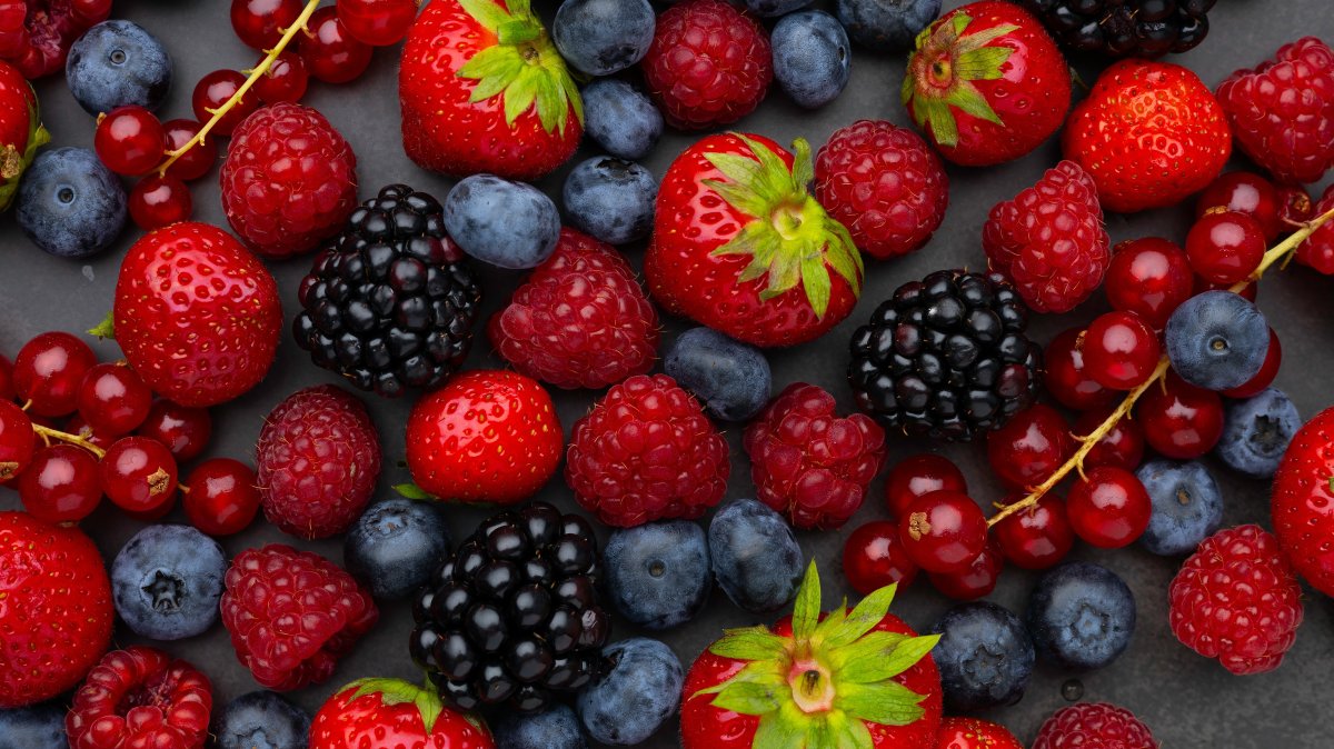 A close-up view of an assortment of fresh berries, including strawberries, raspberries, blackberries and blueberries. (Shutterstock Photo)