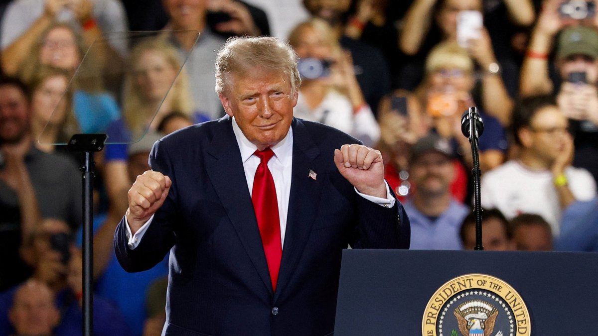 U.S. President Donald Trump dances as he delivers remarks on the economy at the General Motors Proving Ground in Milford, Michigan, U.S., July 27, 2026. (Reuters Photo)