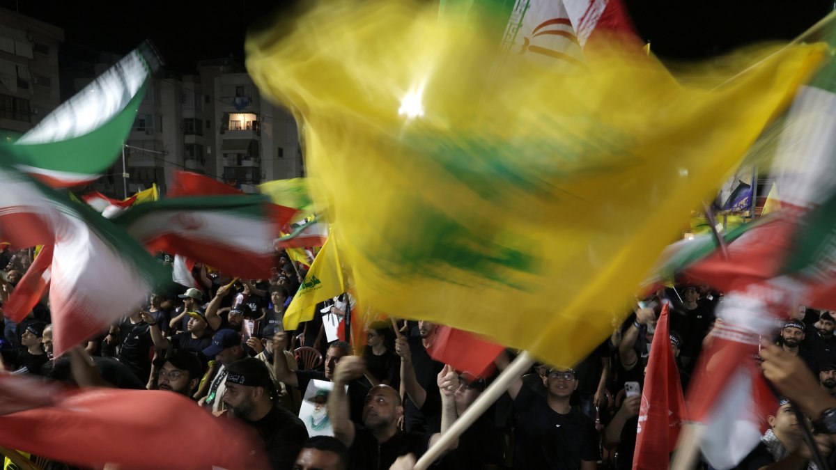 Supporters of Hezbollah carry Iranian and Hezbollah flags during a memorial ceremony for the late Supreme Leader Ali Khamenei in the southern suburbs of Beirut, Lebanon, July 8, 2026. (EPA Photo)