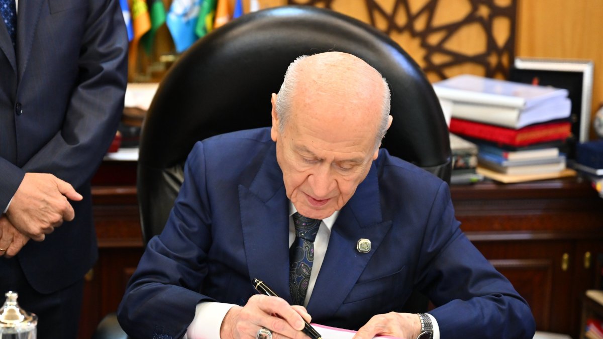 MHP leader Devlet Bahçeli, who first championed terror-free Türkiye, signs the draft bill, Ankara, Türkiye, Aug. 4, 2026. (AA Photo)