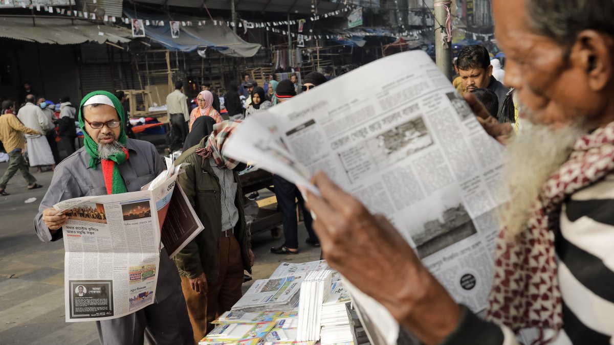 People read newspapers in the morning on the first day of the new year in Dhaka, Bangladesh, Jan. 1, 2025. (Getty Images)