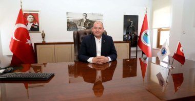 Mayor İlkay Çiçek poses in his office in an undated photo, Izmir, western Türkiye. (DHA Photo)