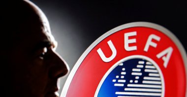A silhouette depicting FIFA President Gianni Infantino is seen next to a UEFA logo in this illustration taken July 30, 2026. (Reuters Photo)