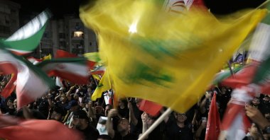 Supporters of Hezbollah carry Iranian and Hezbollah flags during a memorial ceremony for the late Supreme Leader Ali Khamenei in the southern suburbs of Beirut, Lebanon, July 8, 2026. (EPA Photo)