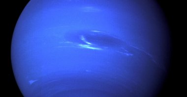 The planet Neptune, including its "Great Dark Spot" – a storm in the atmosphere and the bright, light-blue smudge of clouds that accompanies the storm – is seen in this image taken by the NASA spacecraft Voyager 2 less than five days before its closest approach of the planet on Aug. 25, 1989. (Reuters Photo)