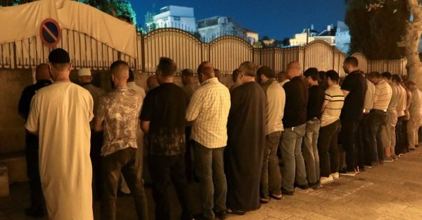 Palestinian worshippers pray outside Al-Aqsa Mosque as Israeli police imposed age restrictions on entry, occupied East Jerusalem, Palestine, July 23, 2026. (Reuters Photo)