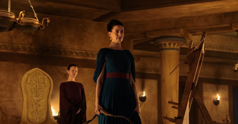 This image released by Universal Pictures shows, from left, Mia Goth as Melantho, and Anne Hathaway as Penelope, in a scene from "The Odyssey." (AP Photo)