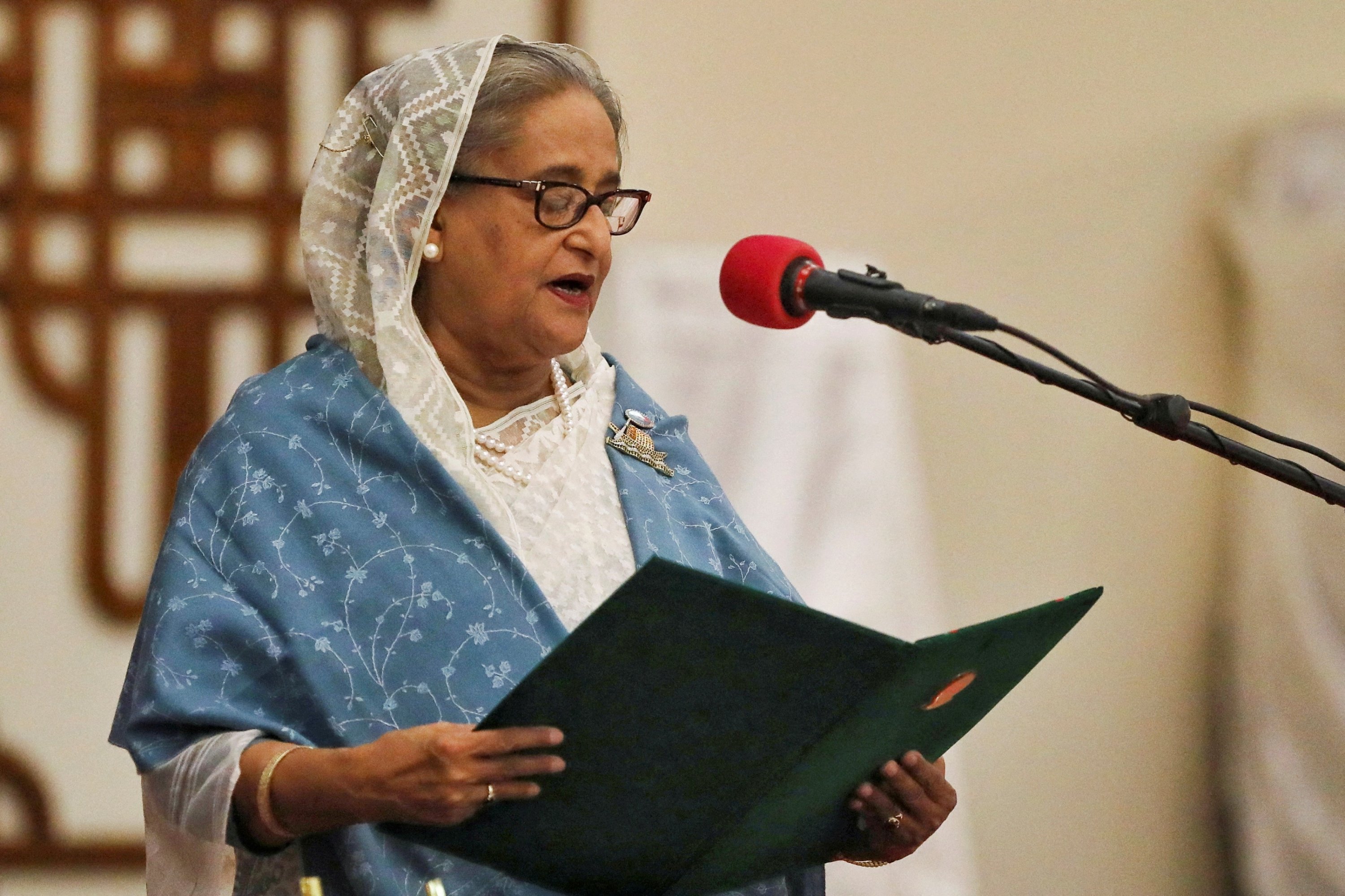 Hasina vows return to Bangladesh, calls for ban on party to be lifted