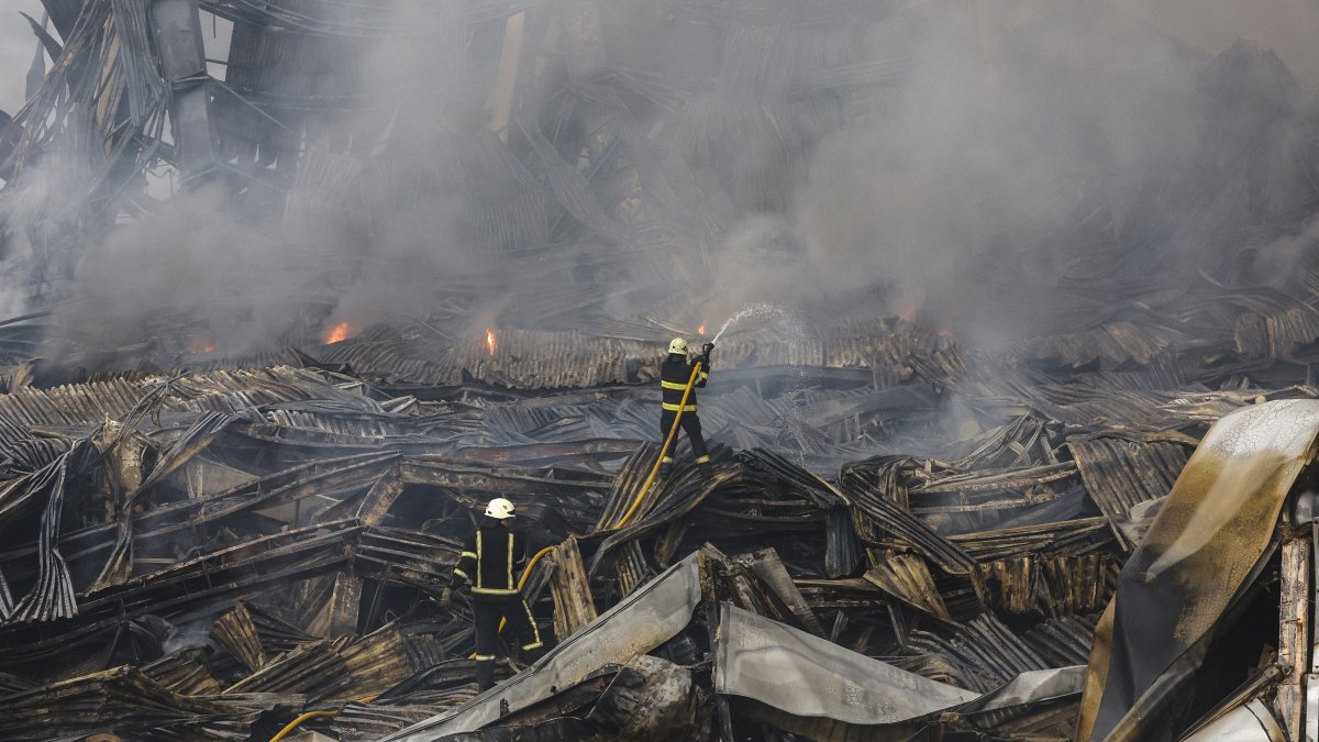 Rescuers work at the site of a Russian missile strike on a goods storage in Kyiv, Ukraine, Aug. 5, 2026. (EPA Photo)