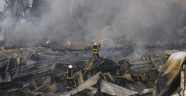 Rescuers work at the site of a Russian missile strike on a goods storage in Kyiv, Ukraine, Aug. 5, 2026. (EPA Photo)