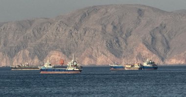 Vessels are seen anchored in the Strait of Hormuz, off the port city of Khasab on Oman’s northern Musandam Peninsula on May 17, 2026. (AFP File Photo)