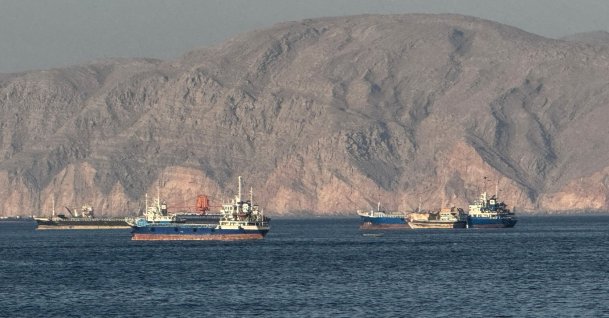 Vessels are seen anchored in the Strait of Hormuz, off the port city of Khasab on Oman’s northern Musandam Peninsula on May 17, 2026. (AFP File Photo)