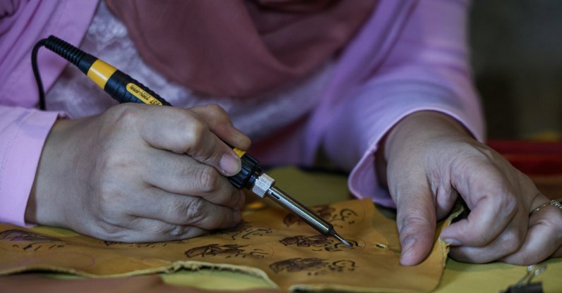 Syrian artisan Yememe Türkmeni works to preserve the traditional art of leather burning, a craft that is at risk of disappearing, Aleppo, Syria, July 31, 2026. (AA Photo)