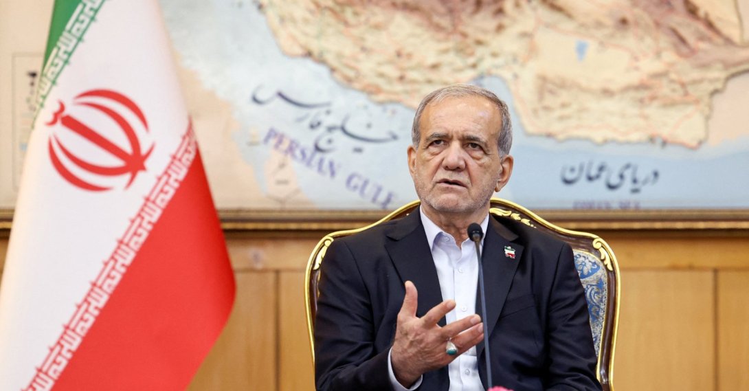 President Masoud Pezeshkian delivers a statement before boarding a plane at Tehran's Mehrabad Airport, Sept. 23, 2025. (Iranian Presidency Handout via AFP, File Photo)