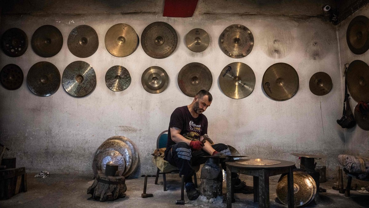 A worker hammers a cymbal at a workshop, Istanbul, Türkiye, July 30, 2026. (AFP Photo)