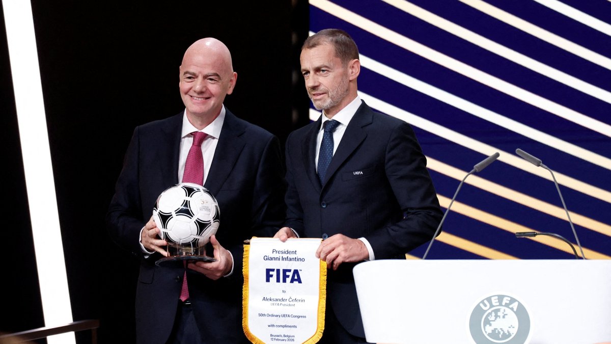UEFA President Aleksander Ceferin (R) and FIFA President Gianni Infantino pose for a photograph during the 50th Ordinary UEFA Congress in Brussels, Belgium, Feb. 12, 2026. (Reuters Photo)
