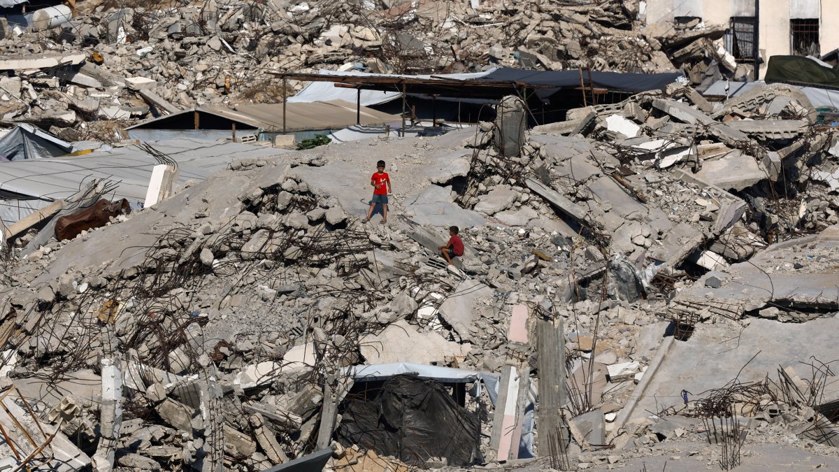 Young Palestinians are seen amid the rubble of buildings destroyed in Israeli attacks at Jabalia refugee camp in the northern Gaza Strip, Palestine, Aug. 5, 2026. (Reuters Photo)