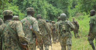 Uganda People's Defense Forces (UPDF) troops are seen on the Mbau-Kamango road in the Beni district, Dec. 8, 2021. (AFP File Photo)