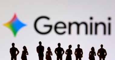 Miniature figurines and the Gemini logo are seen in this illustration taken July 20, 2026. (Reuters Photo)