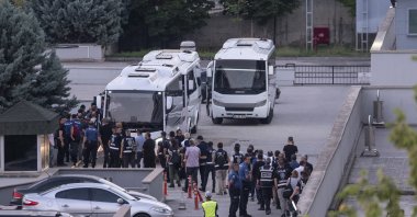 Police officers escort detained staff of Etimesgut municipality and other suspects, Ankara, Türkiye, August 3, 2026. (AA Photo)