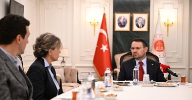 Justice Minister Akın Gürlek (R) meets the sister and son of former police chief Behçet Oktay in Ankara, Türkiye, Aug. 6, 2026. (DHA Photo)
