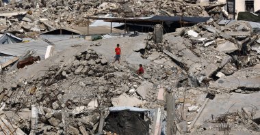 Young Palestinians are seen amid the rubble of buildings destroyed in Israeli attacks at Jabalia refugee camp in the northern Gaza Strip, Palestine, Aug. 5, 2026. (Reuters Photo)