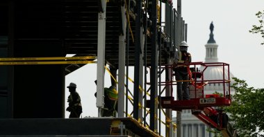 Workers construct a viewing stand ahead of the Freedom 250 Grand Prix on the National Mall in Washington, D.C., U.S., July 26, 2026. (Reuters Photo)