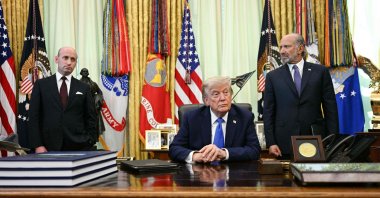 White House Deputy Chief of Staff Stephen Miller (L) and U.S. Secretary of Commerce Howard Lutnick (R) look on as U.S. President Donald Trump speaks after signing executive orders in the Oval Office of the White House in Washington, D.C,, Aug. 7, 2026. (AFP Photo)