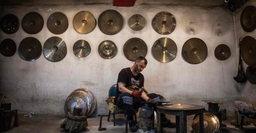 A worker hammers a cymbal at a workshop, Istanbul, Türkiye, July 30, 2026. (AFP Photo)