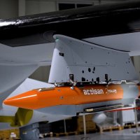 Tolun P precision-guided bunker-busting munition is seen attached to the Bayraktar Akıncı combat drone. (DHA Photo)