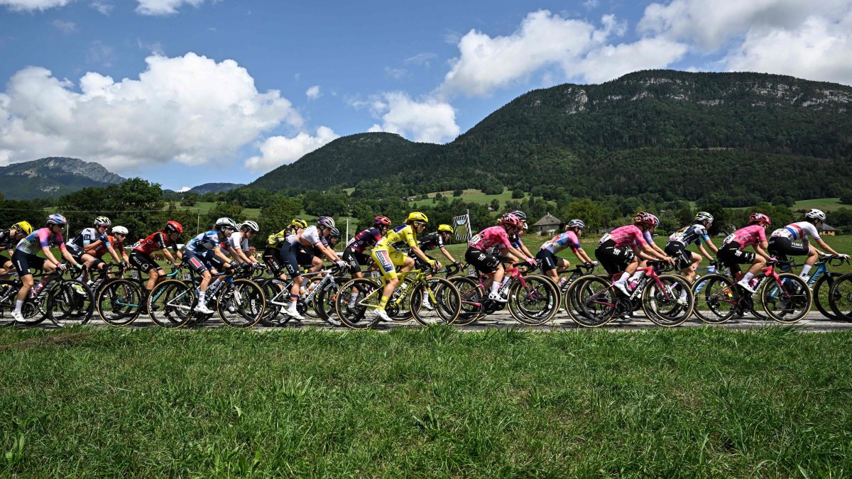 AG Insurance - Soudal Team's Mauritius rider Kimberley Le Court Pienaar wearing the overall leader's yellow jersey and the pack ride during the 8th stage (out of 9) of the fourth edition of the Women's Tour de France - Tour de France Femmes cycling race, 111.9 km from Chambery to Saint-François-Longchamp, near La Motte-en-Bauges, France, Aug. 2, 2025. (AFP Photo)