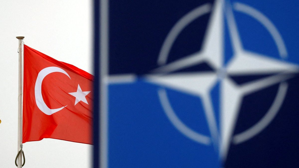 A Turkish flag flies next to the NATO logo at the alliance's headquarters in Brussels, Belgium, Nov. 26, 2019. (Reuters File Photo)