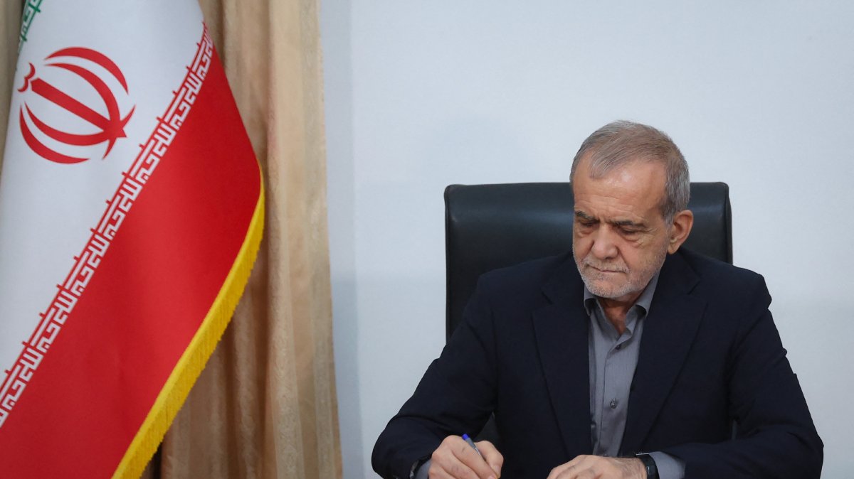This handout picture released by the Iranian Presidency shows Iran's President Masoud Pezeshkian signing a memorandum of understanding in Tehran, June 18, 2026. (AFP File Photo)