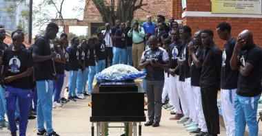 Ugandan players pay homage around the coffin before attending the requiem mass of the late David Owori, 28, a Ugandan international player and captain of SC Villa, who was critically injured by unidentified assailants and was later pronounced dead, at the St. Peter's Catholic Church Nsambya, Kampala, Uganda, Aug. 6, 2026. (Reuters Photo)