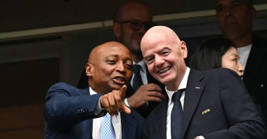 Confederation of African Football (CAF) President Patrice Motsepe (L) points out as he talks with FIFA President Gianni Infantino (R) ahead of the 2026 World Cup round of 16 football match between Canada and Morocco at the Houston Stadium, Houston, U.S., July 4, 2026. (AFP Photo)