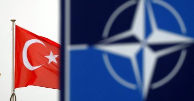 A Turkish flag flies next to the NATO logo at the alliance's headquarters in Brussels, Belgium, Nov. 26, 2019. (Reuters File Photo)