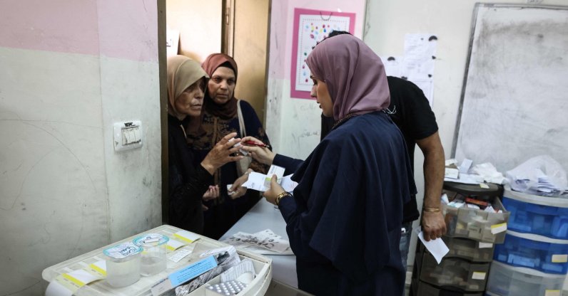 Medics distribute medication to Palestinian patients at a makeshift pharmacy set up by Israeli NGO Physicians for Human Rights-Israel (PHRI)'s mobile clinic in Iktaba, on the outskirts of Tulkarem, West Bank, Aug. 4, 2026. (AFP Photo)